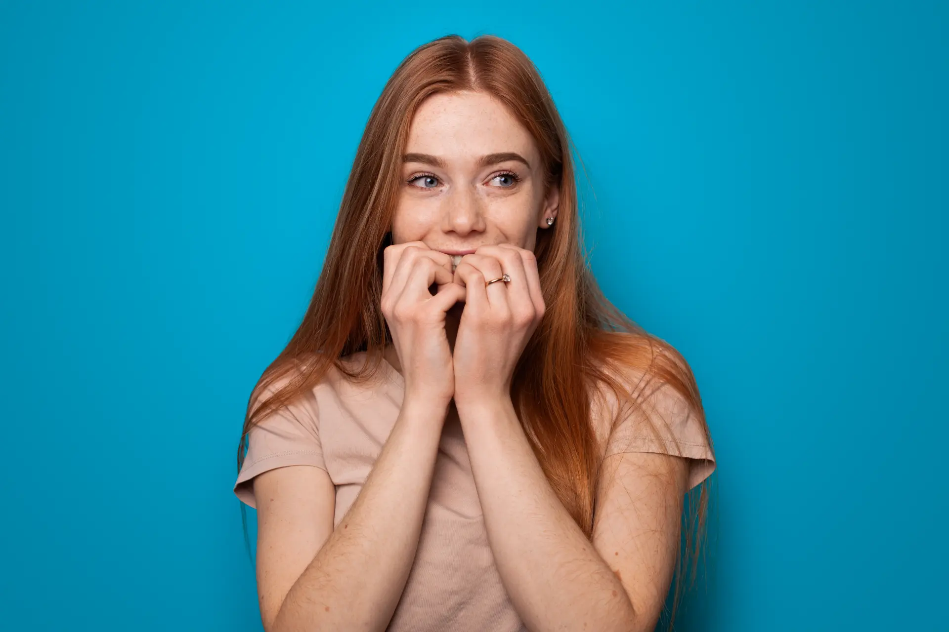 portrait-blue-backdrop-stylish-woman-isolated-white-pretty-young-woman-hand-gesture-ginger-wom