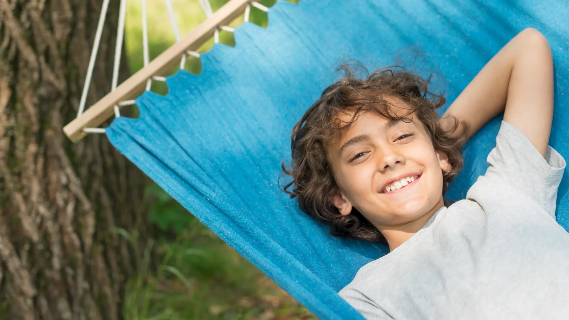 smiley-boy-sitting-hammock
